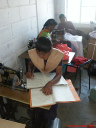 Young woman writing up Tailoring Class notes